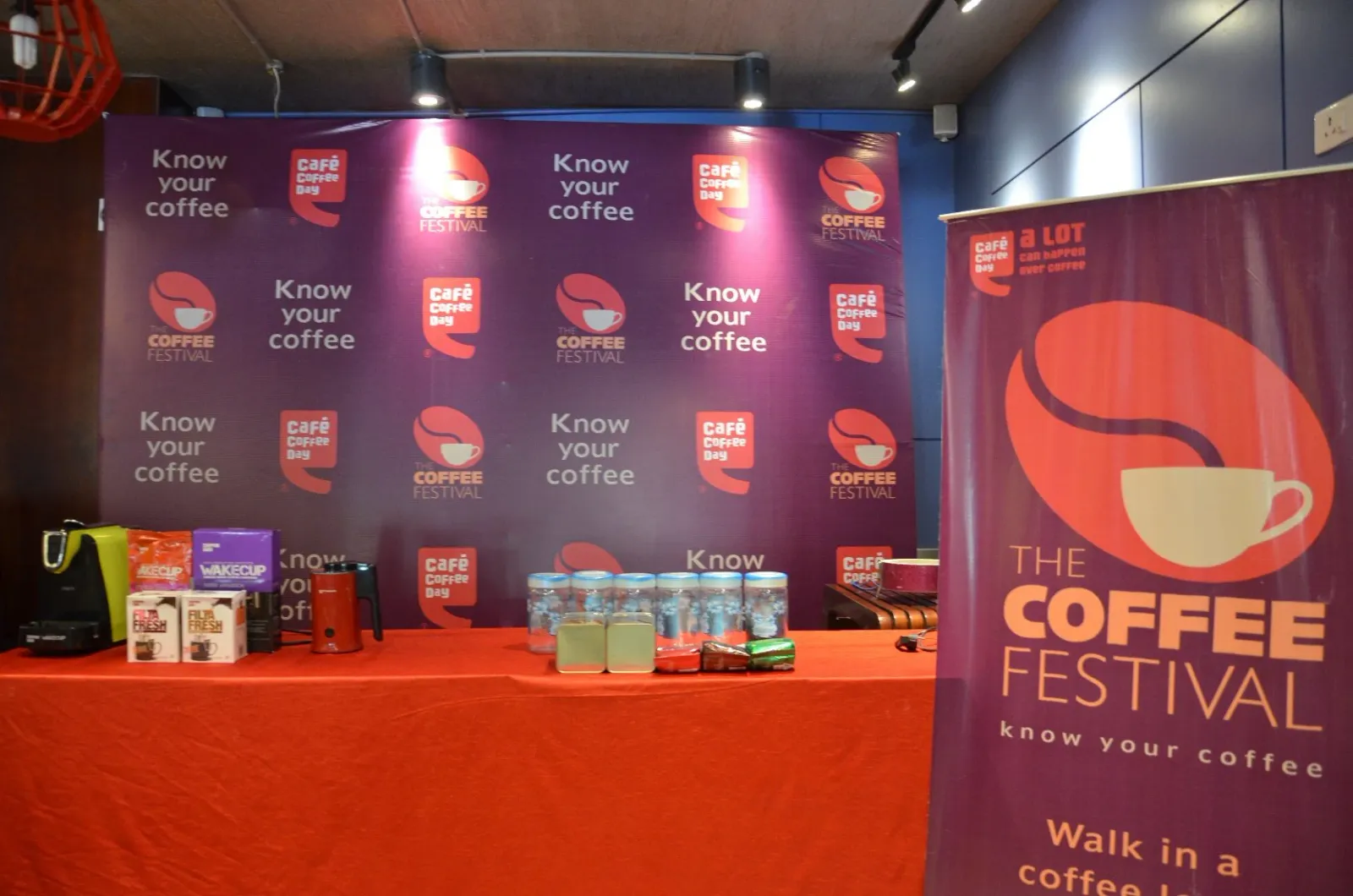 Coffee festival backdrop and product display table at a corporate brand activation